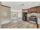 Kitchen open to the living room featuring black appliances and lots of light at 9100 Sw 32Nd Ct, Ocala, FL 34476