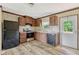 Efficient kitchen with modern black appliances and wood-look flooring at 9100 Sw 32Nd Ct, Ocala, FL 34476