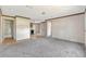 Bright living room features neutral colors and a seamless flow to the kitchen at 9100 Sw 32Nd Ct, Ocala, FL 34476