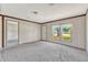 Living room featuring lots of natural light and new, neutral carpeting at 9100 Sw 32Nd Ct, Ocala, FL 34476