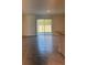 Bright living room with sliding glass doors leading to the backyard at 670 Moscato Dr, Holly Hill, FL 32117