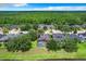 Aerial view of home featuring screened-in pool and spacious yard at 3872 Heirloom Rose Pl, Oviedo, FL 32766