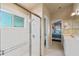 Bathroom featuring tile floors, glass-enclosed shower, and hall access at 404 Hightower Dr, Debary, FL 32713