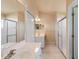Bright bathroom featuring tile floors, dual sinks, and shower at 404 Hightower Dr, Debary, FL 32713