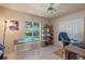 Bedroom with large window, ceiling fan and closet at 404 Hightower Dr, Debary, FL 32713