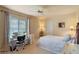 Bright bedroom featuring a desk and sewing machine near a window with natural lighting at 404 Hightower Dr, Debary, FL 32713