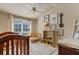 Bedroom featuring neutral walls, ceiling fan, window, and decor at 404 Hightower Dr, Debary, FL 32713