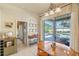 Inviting dining area with views of the patio, access to other living areas, and tile flooring at 404 Hightower Dr, Debary, FL 32713