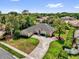 Beautiful home featuring an expansive driveway, manicured landscaping, and a well-maintained lawn at 404 Hightower Dr, Debary, FL 32713