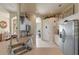 Bright kitchen features white cabinetry, stainless steel appliances, and convenient access to other rooms at 404 Hightower Dr, Debary, FL 32713