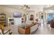 Spacious living room featuring a decorative fireplace, comfortable seating, and bright entryway at 404 Hightower Dr, Debary, FL 32713