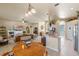 Open-concept living space with bright kitchen, comfortable seating, and tile flooring throughout at 404 Hightower Dr, Debary, FL 32713