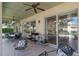 Covered patio with ceiling fans and furnishings, perfect for outdoor living and entertaining at 404 Hightower Dr, Debary, FL 32713