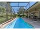 Relaxing screened-in pool with a patio area, perfect for entertaining and enjoying the outdoors at 404 Hightower Dr, Debary, FL 32713