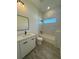 Modern bathroom featuring a shower-tub combo and a white vanity with black hardware at 1102 East Pkwy, Deland, FL 32724
