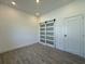 Bright bedroom featuring a modern barn door and recessed lighting at 1102 East Pkwy, Deland, FL 32724
