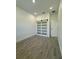 Bright bedroom showcasing modern barn door and recessed lighting at 1102 East Pkwy, Deland, FL 32724