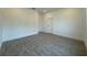 Spacious bedroom features stylish floors, neutral paint, and ample natural light at 1102 East Pkwy, Deland, FL 32724