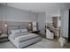Stylish bedroom with modern decor, ambient lighting, and a comfortable sitting area at 1102 East Pkwy, Deland, FL 32724