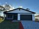 Beautiful single-story home with gray brick driveway and an attached garage at 1102 East Pkwy, Deland, FL 32724