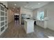 Well-lit kitchen featuring a spacious island, modern appliances, and sleek cabinetry at 1102 East Pkwy, Deland, FL 32724