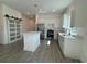 Stylish kitchen with white cabinets, quartz counters, and stainless steel appliances at 1102 East Pkwy, Deland, FL 32724
