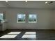 Bright, airy living room with ample natural light and sleek flooring at 1102 East Pkwy, Deland, FL 32724