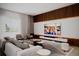 Modern living room with stylish wood accent wall, sleek entertainment center, and comfortable seating at 1102 East Pkwy, Deland, FL 32724