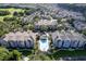 Aerial view of neighborhood featuring a pool, landscaping, and a clear blue sky at 3383 Westchester Square Blvd # 204, Orlando, FL 32835