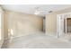 Spacious bedroom with closet and bathroom entrances; carpeted floor and neutral walls at 3383 Westchester Square Blvd # 204, Orlando, FL 32835