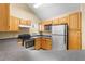 Kitchen area with stainless steel appliances, ample counter space, and wood cabinets at 3383 Westchester Square Blvd # 204, Orlando, FL 32835