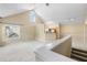 Light-filled living room with vaulted ceiling, a ceiling fan, and a partial view of the kitchen at 3383 Westchester Square Blvd # 204, Orlando, FL 32835
