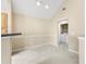 Neutral toned living room with a washing machine, dryer, and vaulted ceiling at 3383 Westchester Square Blvd # 204, Orlando, FL 32835