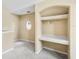 A built-in desk area and shelving with a round window and carpet flooring at 3383 Westchester Square Blvd # 204, Orlando, FL 32835