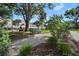 Charming street view with walkway and lush landscaping leading to the buildings at 3383 Westchester Square Blvd # 204, Orlando, FL 32835