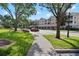 Street view showing the building, walkway, landscaping and parked vehicles at 3383 Westchester Square Blvd # 204, Orlando, FL 32835