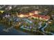 Stunning aerial view showcasing the community pool, lazy river, clubhouse and lush landscaping at 8924 Adriatico Ln, Kissimmee, FL 34747