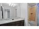 Bathroom with double vanity, granite countertop, and a separate shower and tub at 8924 Adriatico Ln, Kissimmee, FL 34747