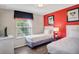 Bright bedroom featuring two twin beds, a colorful accent wall, and themed artwork at 8924 Adriatico Ln, Kissimmee, FL 34747
