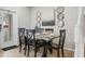 Dining area featuring modern furnishings and tasteful decor, adjacent to a door at 8924 Adriatico Ln, Kissimmee, FL 34747