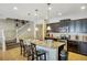 Kitchen with granite countertops, barstool seating, and stainless steel appliances at 8924 Adriatico Ln, Kissimmee, FL 34747