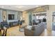 Well-lit living room showcasing comfortable seating and sliding door access to an outdoor patio at 8924 Adriatico Ln, Kissimmee, FL 34747