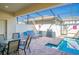 A refreshing screened in pool area complete with ample seating and sun loungers at 8924 Adriatico Ln, Kissimmee, FL 34747
