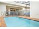 Inviting backyard pool with brick trim, framed by seating and a security fence at 8924 Adriatico Ln, Kissimmee, FL 34747