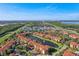 Aerial community view features lush landscaping, and a central water feature at 5530 Metrowest Blvd # 9-211, Orlando, FL 32811