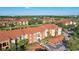 Exterior view of the apartments showing well-maintained grounds and ample parking at 5530 Metrowest Blvd # 9-211, Orlando, FL 32811