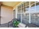 Balcony featuring seating and views of the complex and nearby pond at 5530 Metrowest Blvd # 9-211, Orlando, FL 32811