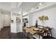 Elegant dining area with a wooden table, stylish chairs, and modern decor at 5530 Metrowest Blvd # 9-211, Orlando, FL 32811