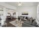 Open-concept living area with a modern sofa, elegant dining set, and contemporary decor at 5530 Metrowest Blvd # 9-211, Orlando, FL 32811