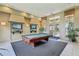 This recreation room has a billiard table, lounge chairs, and TVs at 5530 Metrowest Blvd # 9-211, Orlando, FL 32811